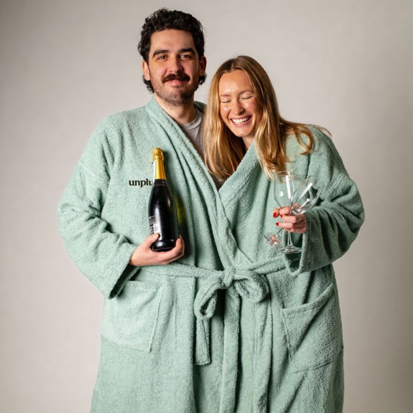 Couple in unisex one piece robe to enhance connection